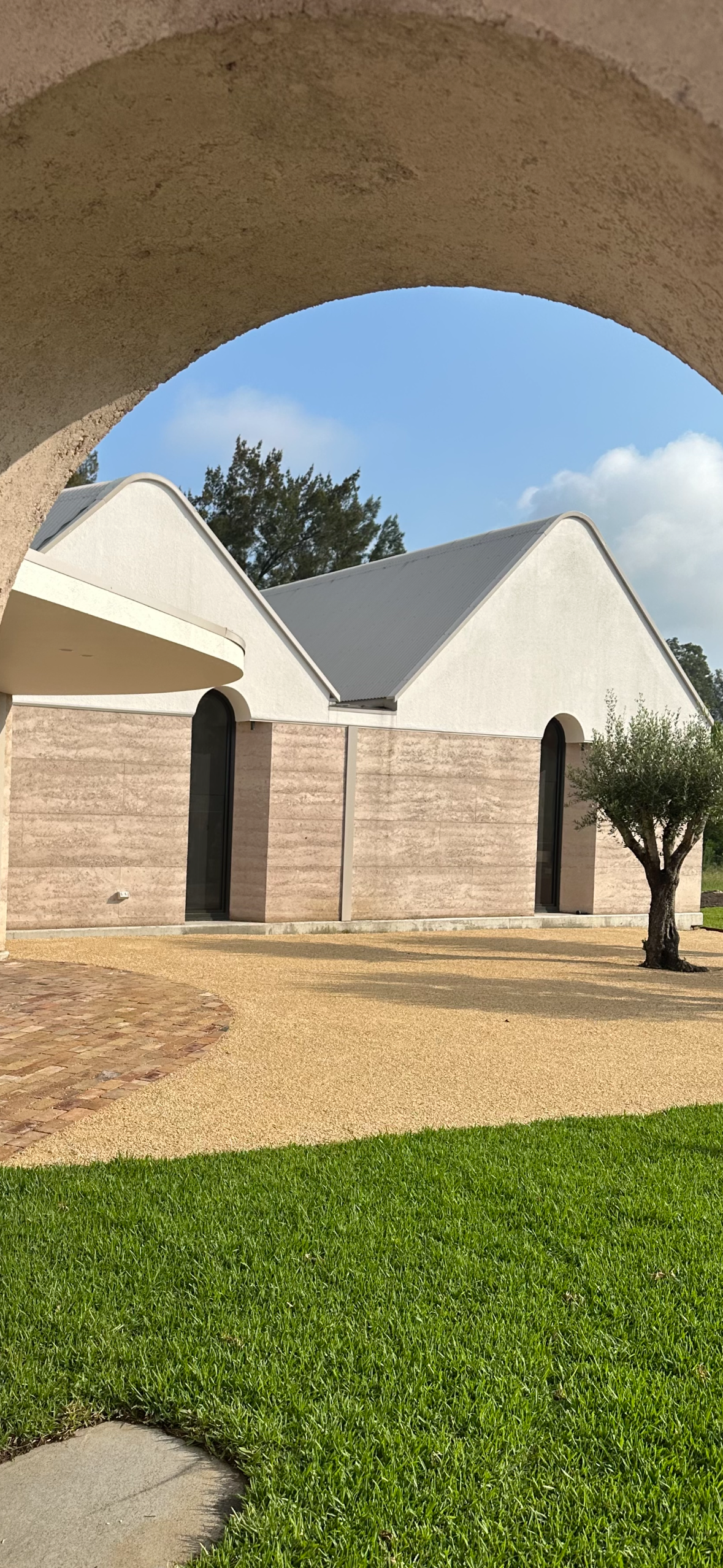 Cement rendering exterior through archway